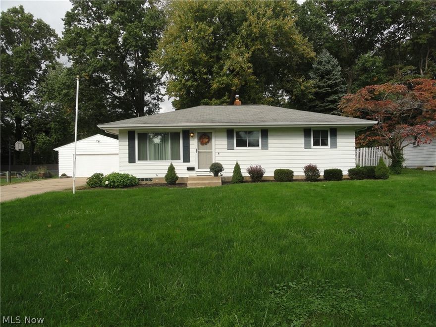 Here's a sharp ranch in a desirable Munroe Falls neighborhood situated on an extra wide lot. Pristine and very well maintained by same owner for many years . 
Impressive curb appeal, deep lot with mature trees and professionally landscaped, concrete driveway, two car garage. Bright and open floor plan, cheery vintage kitchen! Spacious rec room plus office in lower level. New windows in '17, HVAC '14, hardwood floors under that updated carpet. Move in ready! Home Warranty included.