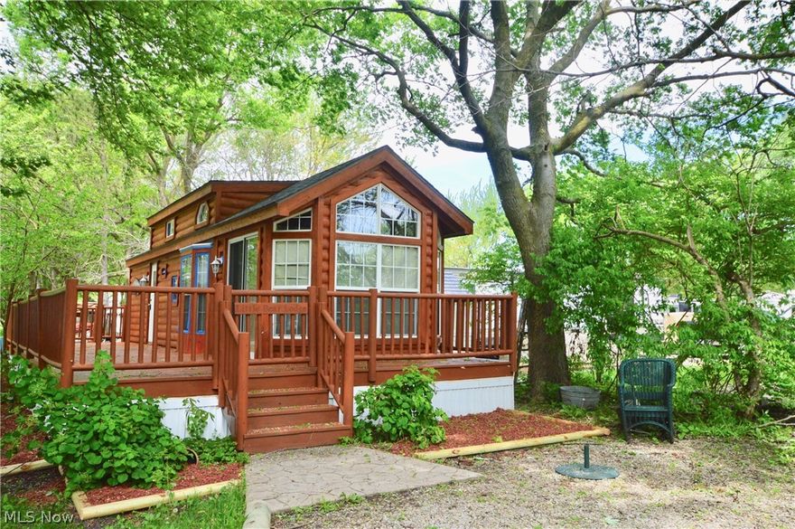 This is an adorable, completely furnished Home Away From Home located in Tall Timbers Campground Resort which is a seasonal resort from May through October.  This RV offers 1 bedroom, 1 bath, kitchen with an eating area, living room plus a lower height loft.  There is a beautiful wrap around deck on the home.  Great location, built in stone fireplace on the exterior.  Please review all the rules and guidelines that are on line.  There is an annual fee of 2045.00 which can be broken down into four payments or paid in full.  The park opens on May 1st and closes on October 31st.   Must be approved by park management.  Pets allowed but restricted