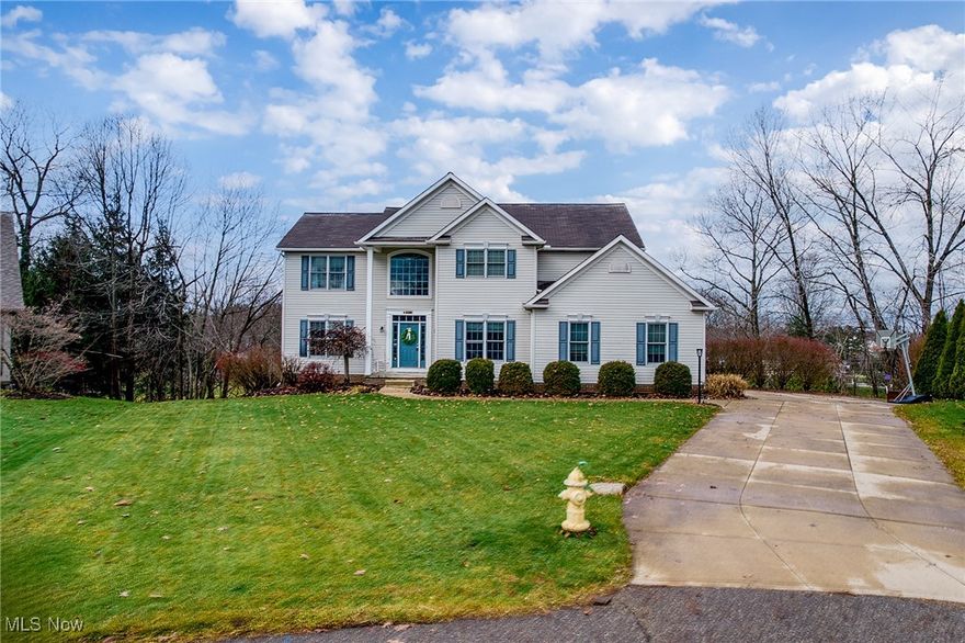 Welcome to this expansive Colonial located in The Kingsbury Reserve Estates in Copley. Step into the impressive two-story foyer and immediately feel the scale and warmth of this beautifully maintained home. Just off the entry is a private office—ideal for today’s work-from-home lifestyle. The living and dining rooms flow together seamlessly, offering a welcoming and comfortable space for everyday living or entertaining. The eat-in kitchen features an island with additional storage, granite countertops, abundant cabinetry, and updated stainless-steel appliances. Open to the kitchen is the stunning Great Room with soaring cathedral ceilings, a fireplace, and generous natural light, plus a slider leading to the oversized upper deck. Upstairs, the primary suite offers a spacious bedroom, a fully updated bath with two separate vanities, a large walk-in shower with a built-in bench, and a massive walk-in closet. Three additional bedrooms and a full bath complete the second level. The lower level offers exceptional flexibility—complete with a bedroom, living area, kitchenette, walkout access to the backyard, and an additional expansive room currently used as a home gym. A newer full bath with a walk-in shower adds even more convenience. This level is ideal for guests, extended-stay living, or an in-law suite. This would be a great multi-generational home! Outside, enjoy the tiered deck that spans the back of the home, providing wonderful outdoor living and entertainment space. Located in the Copley-Fairlawn School District and close to shopping, restaurants, and major highways, this home offers space, versatility, and a fantastic location.