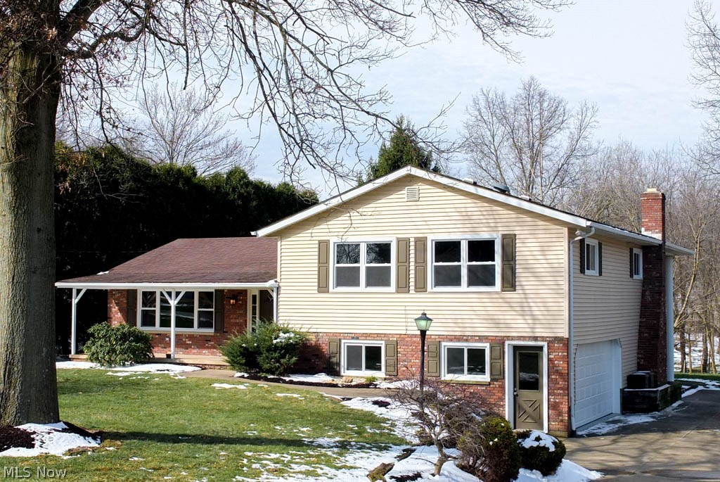 Much bigger than it looks! This beautifully remodeled 3 bedroom, 3 full bath 4-level split has everything you've been looking for and more! Updated bathrooms, renovated kitchen, finished lower level, new flooring and fresh paint throughout PLUS an amazing outdoor space! Stunning kitchen offers wood flooring, granite countertops, new cabinets, a breakfast bar, stainless steel appliances, a deep pantry and is open to the dining room with slider to enclosed back porch. Large formal living room with picture window. Master suite has a built-in closet organizer and a private full bath with dual sink vanity, tile flooring and shower surround. There are two additional bedrooms and a full bath with a new vanity, tile flooring and shower surround. The lower level has an updated full bath and a spacious family room with a brick fireplace and walkout access to the back patio. Wonderful, finished basement boasts an enormous rec room with fantastic storage and a bonus room that could be an additiona