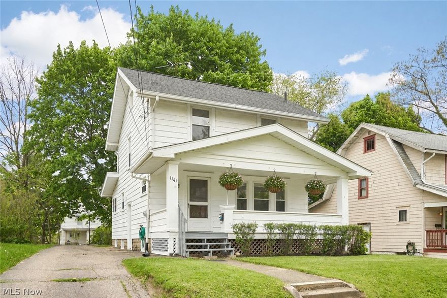 Welcome to this charming 2-story Colonial in Akron, filled w/character, & thoughtful updates throughout. A freshly painted covered front porch creates an inviting first impression & offers the perfect place to enjoy a morning coffee. Recent exterior improvements include new lattice along the sides of the front porch, cleaned & re-pitched gutters for proper flow. Inside, the home blends classic charm w/fresh updates. The walls and ceilings have been recently painted throughout, & new window blinds have been added for a clean, move-in-ready feel. Beautiful refinished hardwood floors extend through much of the main level & 2nd floor, complemented by rich wood trim, wide baseboards, French doors, built-in window seating/storage, & timeless architectural details. The main level offers a comfortable living room w/large windows & an easy flow into the adjoining dining space. The dining area provides a welcoming place for everyday meals or gatherings, while the arched openings add softness & character. The updated kitchen features warm wood cabinetry, new countertops, new sink, new faucet, & a new tile backsplash, creating a practical space w/a nice blend of original character & modern touches. Upstairs, the bedrooms are bright & spacious w/refinished hardwood floors, neutral walls, & many windows. New carpeting has been added to the stairway leading to the second floor & the upstairs hallway, adding comfort between spaces. The updated full bath offers a clean neutral design w/a new tub, faucets, vanity, toilet, & flooring. The LL provides excellent storage, laundry, & utility space. Outside, mature trees & a backyard provide room to enjoy outdoor living. With its covered front porch, refinished hardwood floors, updated kitchen & bath, fresh paint, new blinds, useful basement space, & classic Colonial charm, this Akron home offers a warm & practical appeal & is ready for its next chapter.