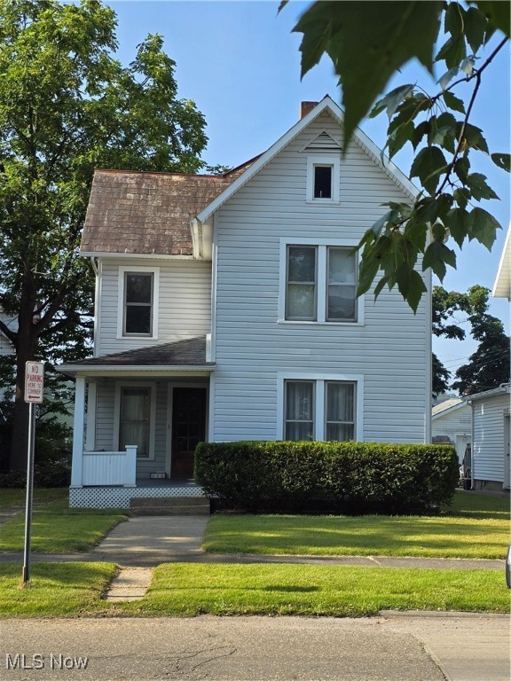 This charming 4-story home offers 4 bedrooms and 1.5 bathrooms, complete with a full basement providing ample storage and utility space. Step inside and be greeted by the warmth of hardwood floors and exquisite, original woodwork throughout. The main floor offers a well-designed layout featuring a spacious kitchen, a dining room that is perfect for gatherings, a comfortable living room ideal for relaxation, and an additional versatile room that can be used as a home office, playroom, or den. A convenient 2-car garage ensures easy parking. Situated in a desirable location, this property is conveniently close to elementary, junior, and senior high schools, making it perfect for families. The home is also within steps to downtown and close to I-77, providing excellent access to local amenities and commuting options. Enjoy the outdoors on the enclosed rear porch. The kitchen appliances, including the stove, dishwasher, and refrigerator, will stay with the property, along with a chest freezer for added convenience. Call for a private viewing of this home today.
