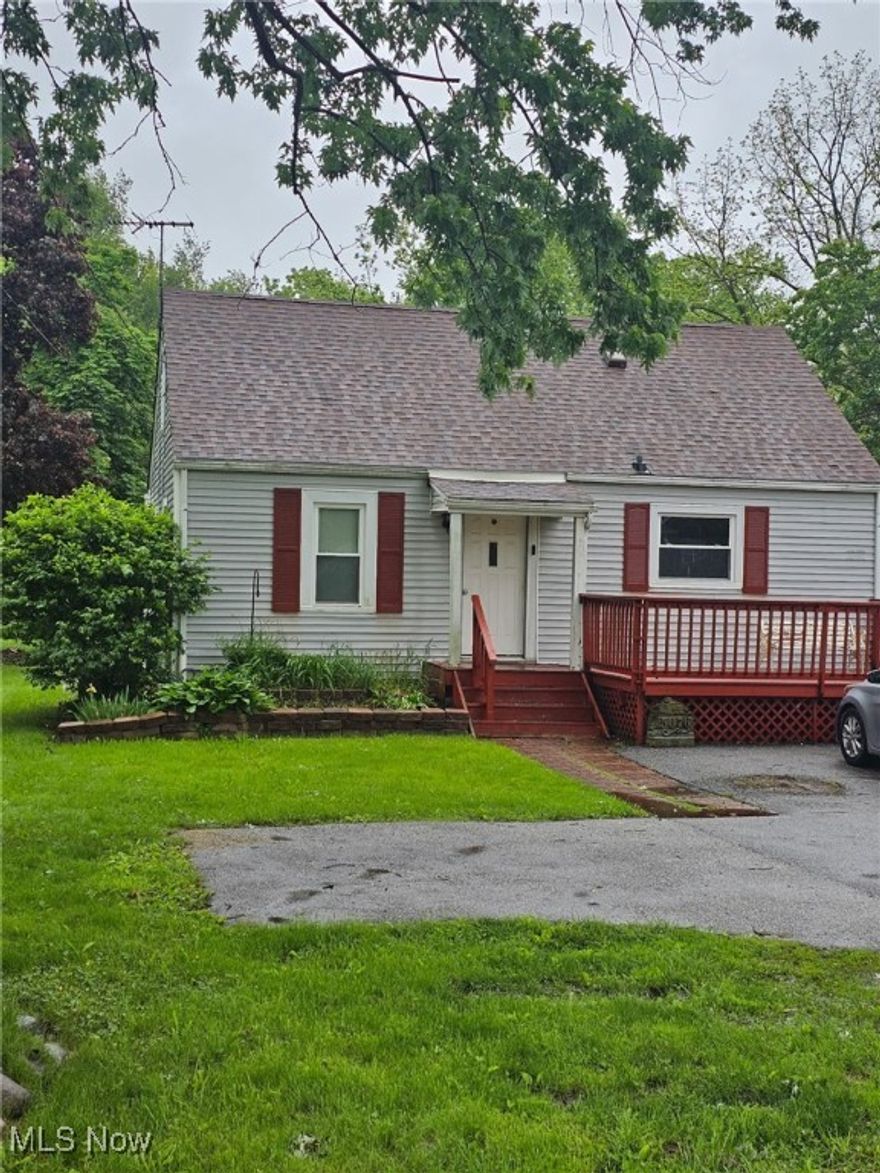 Beautiful 3 bedroom, 1 bath Cape Cod in Brimfield Township has so much to offer with a nice size deck for family and friend gatherings, 3 outbuildings: 14 x 20 heated outbuilding, another out building that is 12 X 10 and an additional shed.