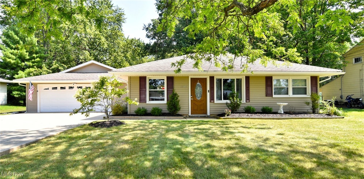 Step inside this thoughtfully updated 3-bedroom, 2-bath ranch offering 1,388 sq. ft. of comfortable one-level living. The open living and dining room provides a natural gathering space, anchored by easy flow into the kitchen and private bedroom areas. The spacious primary suite is a standout, featuring a cozy fireplace, sliding doors to the back patio, and a beautifully renovated en-suite bath. Updates include a dual-sink vanity, modern tile shower, and sliding barn door. New carpet (2025) in the primary bedroom and new flooring in the laundry room add a fresh touch. Two additional bedrooms and a full bath sit just off the main living area, providing flexible space for a variety of needs. The galley-style kitchen blends modern design with functionality, offering new butcher block counters, striking gold accents, and all appliances included. A breezeway connects the garage and patio, providing a versatile storage/pantry area. Out back, discover a fenced, expansive patio designed for entertaining, complete with a hot tub, natural gas fire pit, and wiring for outdoor speakers. The large yard offers generous shade, and a concrete-floored storage shed extend the property’s utility. The attached garage offers comfort and convenience with a heater, window AC, surround sound wiring, and eye-catching hex lighting—making it usable year-round. The driveway is triple wide and both the home and garage are equipped with smart locks for added peace of mind. Don't miss out on this gem - schedule your showing today!