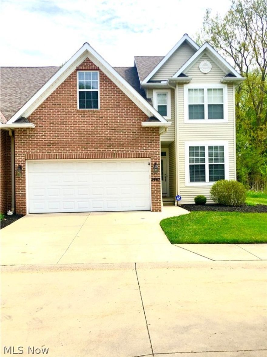 Wow! Move right in to this updated, contemporary townhouse. This END unit condo on a dead end road has it all! The first floor features an open floor plan with gorgeous laminate wood flooring throughout. A large great room with cathedral ceilings and beautiful windows, natural light galore! The beautiful kitchen with tons of cabinets, granite countertops, stainless steel appliances, and a bonus walk-in pantry!  The sliding door off the kitchen takes you to your adorable patio, surrounded private green space. An updated half bath, laundry room and office/den complete this level. The second level welcomes you up the large stairwell to your master suite with two large closets and a large private bath with his and her sinks. Two additional large bedrooms and updated full bath complete the upstairs. The large finished basement can be used as additional living space or rec room plus a bonus half bath. Tons of storage and closets throughout this home. Attached two car garage. The exterior of