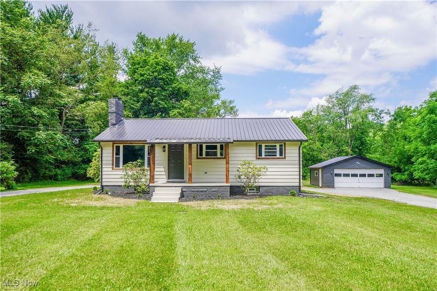 This beautifully updated ranch on 2.73 acres in Plain Local Schools is ready for you to move right in! Every major update has been done, including a new roof, windows, septic, furnace, A/C, hot water tank, and well pump. The metal roof and covered front porch add so much charm to the curb appeal. Inside, the open floor plan brings together the living room with hardwood flooring and a stone fireplace and the brand-new eat-in kitchen with stainless appliances, a tile backsplash, and vinyl plank flooring. All three bedrooms have new carpet and share a fully remodeled bath with a tub and tile surround. The clean, spacious basement has laundry hookups, glass block windows, plenty of storage, and lots of potential to finish for extra living space. Step outside to enjoy the peaceful setting with open areas for gardening and outdoor fun, plus a wooded section and a circular drive leading to the detached two car garage. Schedule your showing to see everything this property has to offer today!