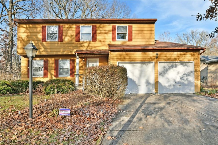 This charming home offers great potential for those looking to put their personal touch on a classic space. Located in a quiet, established neighborhood in Girard, the house features a traditional exterior with siding and a front porch. Inside, the layout is spacious, with a large living that leads into the dining room. The windows allow plenty of natural light to fill the room, giving it a bright and airy feel. The kitchen has a breakfast bar and also is open to the family room, which has a fireplace.  The bonus rec room off of the family room provides additional space for the family.  The laundry room is also located off of this space.  Upstairs you will find 4 bedrooms and one full bathroom.  The backyard is a private and serene space with mature trees making it a perfect relaxation spot. Sell as-is.