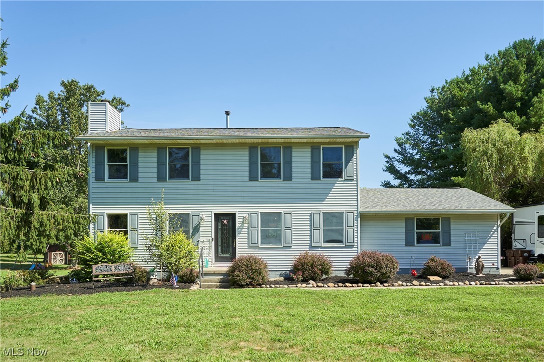 Welcome to 3741 Bassett Rd in Rootstown! This 3-bedroom, 2.5-bath colonial is set on 2.24 acres and offers just under 2,000 sqft of comfortable living space in a convenient location. You'll love the large, updated living areas and spacious upstairs bedrooms, plus a partially finished basement that adds even more versatility. The property features an attached 2-car garage and an additional detached 1-car garage or workshop—perfect for extra storage or hobbies. Step outside and enjoy the recently renovated outdoor kitchen, ideal for entertaining or relaxing evenings. Don’t miss your chance to tour this well-rounded property—schedule your private showing today!
