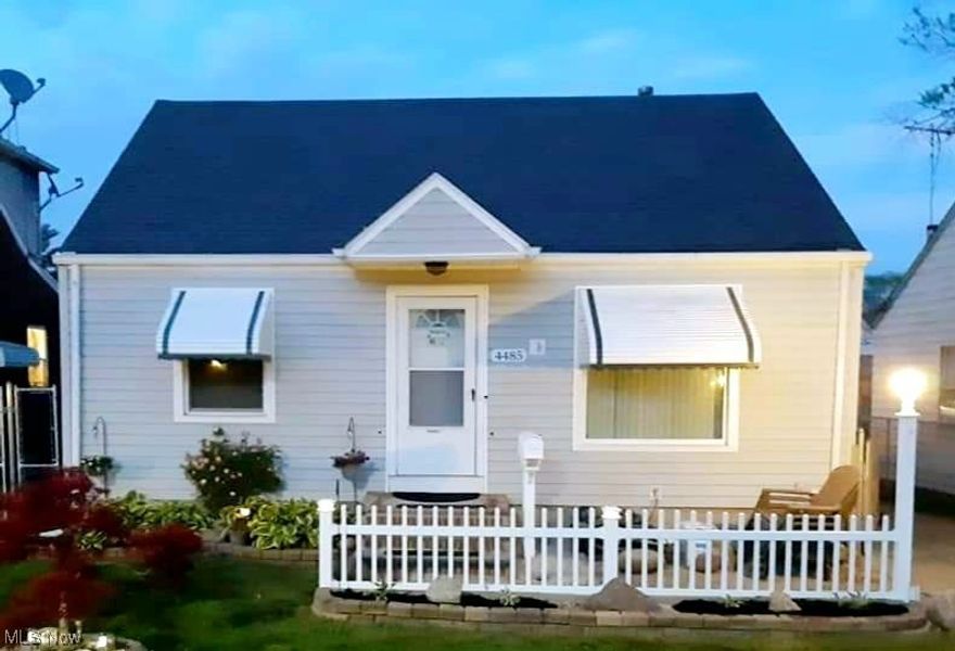 This three-bedroom, two full bath bungalow was well loved and looking for a new family!  House is vinyl sided, and interior freshly painted, with hardwood floors throughout.  The kitchen & dinette was updated in 2020 with plenty of cabinets, ceramic backsplash & floor (extra floor tile in basement). Stove, refrigerator, and two-year-old dishwasher topped with a reclaimed wooden tabletop from a Tremont restaurant that stay!  The main bath was done in 2012 with a pretty ceramic tiled tub surround & floor.  The front porch was rebuilt in 2020, New windows throughout in 2018 except the kitchen window, and the roof was replaced in 2015.  The backyard is fenced in, and drainage was added from the backyard to the street in 2021, the two car garage is in good shape with a 240 line, and electric door openers.  The lower level has a second bath, and is partially finished with knotty pine paneling, and a bar for entertaining.  The entire basement floor was freshly painted, and the walls dry locked for a fresh clean finish.  Kitchen appliances stay along with two A/C units, and the extra fridge & deep freezer and the dryer in the lower level.  House has been fully insulated.  This house has been well maintained, and ready to move in!