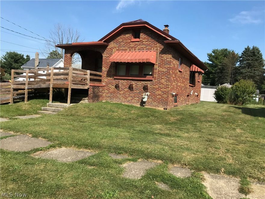 Nice cozy 2 BR, 1 bath brick ranch home.  Almost new metal roof, appliances included, corner lot, & 2 car detached garage.  The home has had some updates to make it somewhat handicapped accessible, including bathroom update and a ramp to the front door.