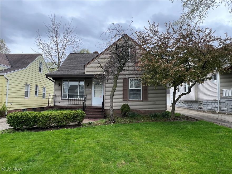 Beautiful cape cod on great Garfield Heights side street north of Rockside.  Vinyl siding.  Newer windows.  Modern white kitchen with granite countertops and stainless steel appliances.  Nice hardwood floors.  Large finished basement with full bath.  Rear deck.  Central Air.  Two car detached garage with remote access.  City of Garfield Heights compliant.  Move in ready.