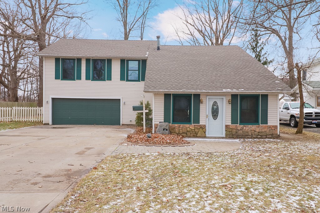 Welcome home! With over 2200 square feet, this spacious colonial is waiting for you to move right in! Upon pulling in notice the large driveway with plenty of parking space and the hand stamped walkway to the front door. The new kitchen boasts soft shut cabinetry, plenty of counter space, island with space for seating, and new flooring! The large dining room makes entertaining a breeze! Enjoy your spacious living room with sliders to your patio and fenced in backyard! There are four large bedrooms with closet space galore- storage in this spacious home is abundant!! There is a bonus room that could be used as a 5th bedroom or so much more! Notice, there is a full bathroom on each floor each with plenty of room and storage! Don't forget the laundry room with shelving, oversized two car garage with access to the backyard, and the storage shed! Roof is less than 2 years old. Home Warranty provided! Schedule your private showing today!