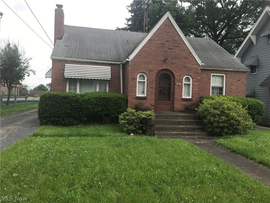 Large cozy Living room with fireplace, formal dining room, 3 bedroom, 2 baths, hardwood floors, sunroom & a 2 car garage. All brick home.