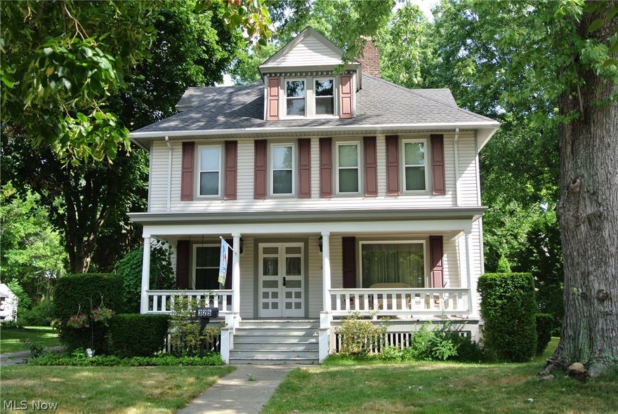 Turn back the Clock!  A true treasure of the glorious style and charm of a century home!  Stunning woodwork through out.  Double stair case, large parlor with a fireplace, living room with bay windows, dining room with crown molding, window seat.  Gorgeous hardwood flooring, large kitchen with lots of cabinets, dishwasher (2 years old), new back splash, counter tops, sink and faucet.  Opens up to a large maids pantry.  Main roof approximately 2006, replaced main server line, electric line infront of house and gas line from street.  Replaced windows, central air, basement waterproofed from outside from inside except laundry room.  Attic 5th bedroom.  Updated 2nd floor bath.  Deck and large 2 car garage with attic.