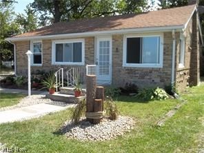 Great home at a great price if you are looking for Lake Front Property! This home has been completely remodeled new flooring, bathrooms, kitchen cabinets, Back splash, Stainless Steel Whirlpool Appliances, Ceiling Fans, Light Fixtures, Auto Mini Blinds,basement has been waterproofed 2017, Roof was replaced approx 5 yrs ago & also has newer windows. Home has an updated Kitchen that flows into the Dining Room w/new ceiling fan & sliders to the deck great location for grilling out. Large Bedroom off the Dining Room. Dining Room is open to the Spacious Living Room w/new ceiling fan, fireplace w/electric insert & great views of the lake. Living Room also has a open space off of it that would be perfect for a home office or sitting area that is right next to the front windows with lake views. The Laundry is on the first floor along w/a nice cedar closet. Full Bath off the Hallway & 2 Bedrooms, with 1 of the Bedrooms having a Full Bath. Everything is completely updated. The back yard is large
