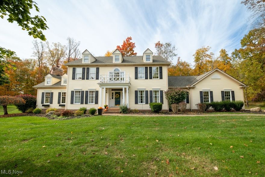 Welcome to this Custom, James A Young designed, Center Hall Colonial in Hudson Park Estates. This unique home offers Tall Ceilings, Hardwood floors and White Crown molding and trim throughout the first floor formal rooms, showcasing excellent craftmanship. The covered entry way brings you to the foyer where you have two coat closets. To the right is a bright living room with built-in bookcases. Through windowed French Doors to the contrasting Den with rich warm wood paneling, closet and gas Fireplace. Left of the Foyer is the gorgeous Dining Room with current wall paper above the Wainscoting and a stunning tray ceiling. The beautifully updated Kitchen has floor to ceiling cabinets, some with glass fronts and granite counter tops with contrasting breakfast bar! Top of the line stainless Steal appliances, including a Kitchenaid convection wall oven, Wolf Stove and Bosch Dishwasher, Under cabinet lighting, pendant lighting, appliance garage and stunning ceramic tile backsplash. Beautiful glass doors from eat-in area to the new Trex deck and brick patio. Vaulted ceilings with actual dormers, a Bay window and windows with arch tops bring abundant light to the Family Room. The Brick Chimney to the ceiling with wood mantel makes this wood burning Fireplace the focal point of the room. Back Hall has an Updated Full Bath with In-Law Suite Possibilities. Plus the Laundry Room with Window, large pantry closet and new sink and a lovely Mud Room with coat closets and door to the 3 car garage. Upstairs there is a lovely wide Hallway with a Hall Bath that opens to one bedroom and the hall for two more bedrooms  The Primary Bedroom has a vaulted ceiling, large Bathroom and Walk-in Closet! In the Lower Level there is a Recreation area, Large Shop area, rough-in for Bathroom, an office/studio and plenty of storage. Hudson Park Estates is a popular Swim and Tennis neighborhood with lessons, fishing and Social Events. Close to Hudson City Schools and new sidewalks to downtown Hudson!
