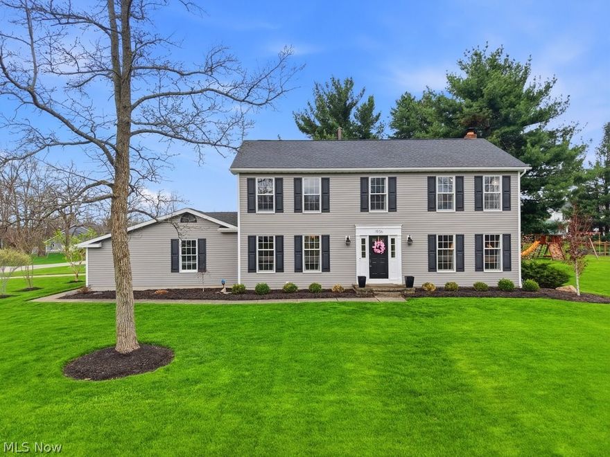 Welcome to this beautiful home in desirable North Hudson, where classic design meets everyday comfort. A welcoming foyer is flanked by a formal living room and elegant dining room—perfect for entertaining or quiet gatherings. The heart of the home features a spacious kitchen with granite countertops, stainless steel appliances, and abundant cabinetry, all opening seamlessly to a large family room anchored by a cozy fireplace. The eat-in kitchen provides easy access to the outdoors through two sliding glass doors, leading to a deck that overlooks a generous backyard complete with a fire pit, playset, and garden with irrigation system—ideal for relaxing or hosting all season long. A convenient half bath and first-floor laundry room round out the main level. Upstairs, the primary suite offers a peaceful retreat with a recently updated shower and a walk-in closet. Three additional generously sized bedrooms—one with its own walk-in closet—share a well-appointed full hall bath. The finished lower level adds even more living space, perfect for a rec room or game nights, and includes a pool table that stays with the home. Major updates provide peace of mind, including a new roof, siding, and gutters (2018) and furnace (2023), along with many additional improvements.