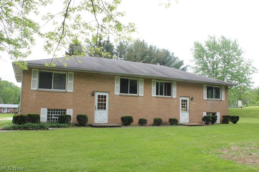 Well maintained all brick duplex having 2 bedrooms, 1 bath, approx. 800SF & 1 car attached garage (each side)* Additional 200 sq ft  each unit (walk out lower level recreation room)* Updates include, but not limited to, furnace  #714 (15 mos.), carpet #714 new, carpet #712 (approx. 5 yrs), hot water heaters (16 mos. & 3.5 yrs.), windows..all but 2 (2000 & 2001), aerator (6.5 yrs), sum pump (7 mos.), softener (8 yrs.), pump (3.5 yrs)* Located on quite street across from Portage Lakes State park* Rented on average for $700 per month, each side*  Storage barn*  Dryer... Both Electric and gas connection available *  Plenty of parking*. Ideal and available for owner occupant*