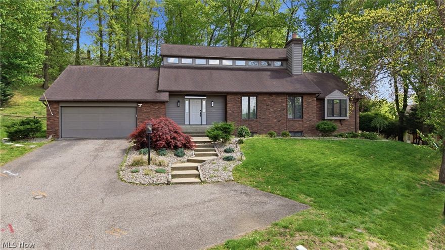 Enjoy serene, wooded views in this nicely updated home featuring 4 spacious bedrooms and 4.5 baths. The large, eat-in kitchen is equipped with new stainless-steel appliances, sleek new countertops, and ample space for family gatherings. The updated laundry room and primary bath add modern convenience, while new carpeting in the recreation room offers comfort for relaxation or entertaining. Hardwood floors flow throughout the home, enhancing its warm and inviting atmosphere. Located in the desirable Greenmont neighborhood, this home perfectly blends style, functionality and tranquility.