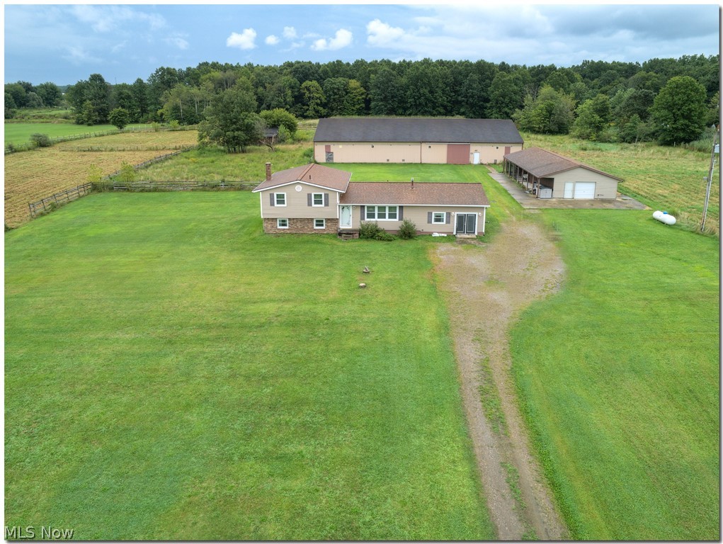 17 gorgeous acres! 3 bedroom 4 level split with full basement. Sliders off dining room go to stamped patio. Carpets cleaned, bedrooms and bathroom freshly painted. New carpet in one bedroom. Nature-stone floor in lower level office/craft area and basement. Original attached garage was converted to additional living space. Roof, siding and windows 2004. Whole house generator. Outbuilding built in 2003 has concrete floor, 5 dog kennels, water, can be heated. Horse barn with indoor arena, 8 horse stalls, mini stalls. Pastures. Pond. One year home warranty.