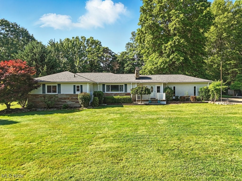 Charming & unique 3-Bedroom Ranch with a basement located on a peaceful street with NO HOA! Roof 2024. HVAC 2014 HWT 2014, Windows (Approx) 2014 Welcome to this delightful home with unique & distinctive features combined with a flair of a 50's style ranch with easy access to local amenities, restaurants, parks & shopping. Wide entertainment areas on the main floor are complete with open kitchen plan with granite countertops, subway tile backsplash, deep kitchen sink, newer double oven, cooktop, microwave, refrigerator, newer dishwasher and extended countertop space. Spacious living room with large windows allows for plenty of natural light & a two sided fireplace dividing the living room and family room with separate entertainment spaces. Off the main areas find three bedrooms with ample closets and a full bath with double sinks. The primary bedroom has a dedicated primary bath with double sinks and a recently updated oversized zero entry master shower. The hallway is lined on one side with closet space for additional storage. The full size unfinished basement adds more storage with a dedicated workshop waiting for customization to suit your needs. Extended dining room area allows for surplus space for additional guests with a slider to a back maintenance-free composite deck and large garden space over looking a large wooded backyard complete with 2 outdoor firepits, a trellis, strewn with late summer blooming vines, over the cement patio shaded by a large oak tree. Attached 2 car oversized side entry garage. Extended driveway back to an additional the 2 car garage with an additional work space added behind plus an additional workshop/storage space structure behind with French doors. Storage suitable for a home business/workshop. Bring your imagination and open mind to this out of the ordinary home.