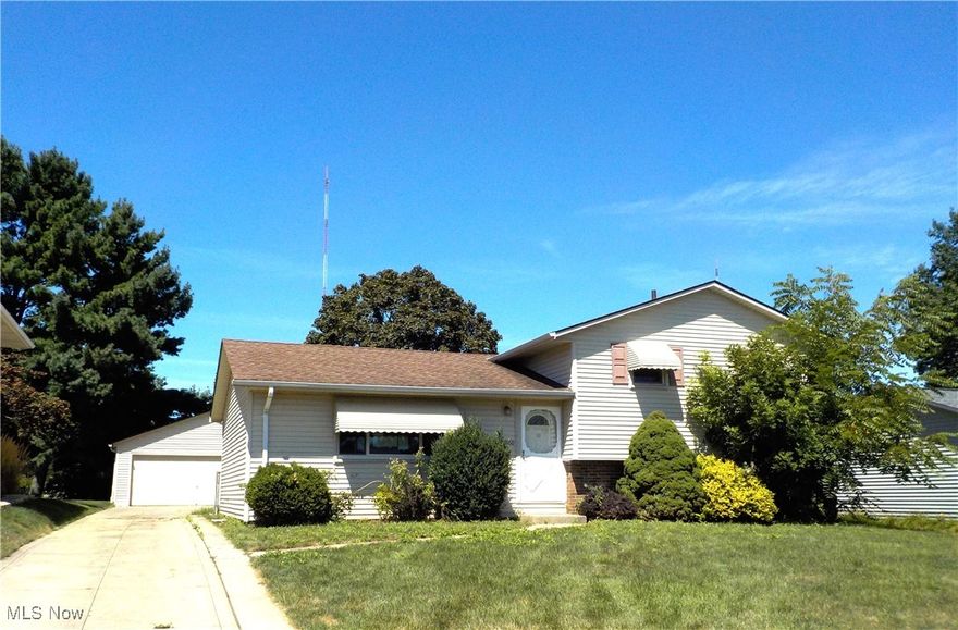 3 Bedroom, 1.5 Bath Split-Level waiting for your personal touches in the heart of Parma near Pleasant Valley Shopping Center, schools and has easy highway access..  Spacious living room and dining area leads to Kitchen. Upstairs features 3 Bedrooms and 1 full bath. Lower lever features a Family room, laundry area and 1/2 bath with walk out access to the fenced yard and spacious two-car garage that provides plenty of parking and storage. Central AC.