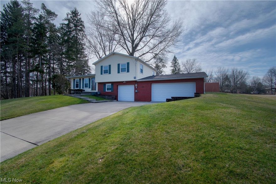 Beautiful split-level home sitting on a .36-acre lot has so much to offer. This family-friendly home has over 1,300 sq ft of bright living space. Welcomed by the great room that features a brick accent wall, a woodburning stove, and an abundance of natural light. The open-concept great room leads to the dining area and kitchen. The spacious kitchen has cabinets galore, stainless steel appliances, hardwood floors, and a walkout to the back patio great for entertaining friends & family. The large fenced-in backyard is perfect for kids and pets to play safely. The Lower level features a family room, a large linen closet, a convenient full bath with a walk-in shower, and access to the three-car garage off the family room. Upstairs offers three bright bedrooms with stunning hardwood floors and another full-size bath with a large vanity, an oversized mirror, and tile floors. Located in the basement is a fourth bedroom with a large closet and ample storage space. A must-see! Make an appointme