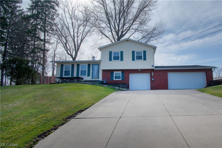 Beautiful split-level home sitting on a .36-acre lot has so much to offer. This family-friendly home has over 1,300 sq ft of bright living space. Welcomed by the great room that features a brick accent wall, a woodburning stove, and an abundance of natural light. The open-concept great room leads to the dining area and kitchen. The spacious kitchen has cabinets galore, stainless steel appliances, hardwood floors, and a walkout to the back patio great for entertaining friends & family. The large fenced-in backyard is perfect for kids and pets to play safely. The Lower level features a family room, a large linen closet, a convenient full bath with a walk-in shower, and access to the three-car garage off the family room. Upstairs offers three bright bedrooms with stunning hardwood floors and another full-size bath with a large vanity, an oversized mirror, and tile floors. Located in the basement is a fourth bedroom with a large closet and ample storage space. A must-see! Make an appointme