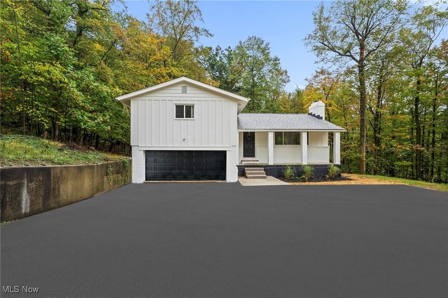 Welcome to 9035 Wallings Road — a stunning, fully renovated residence that perfectly blends modern elegance with serene natural surroundings. Nestled on nearly 2 acres in North Royalton, this 3-bedroom, 2-bath home offers over 2,000 square feet of luxurious living space designed for both comfort and style. The open-concept layout is anchored by a chef-inspired kitchen featuring white shaker cabinetry, quartz countertops, a dry bar, and premium stainless steel appliances. White oak luxury vinyl flooring flows seamlessly throughout, enhancing the home’s bright and sophisticated aesthetic. The primary suite serves as a private retreat with a spacious walk-in closet and a spa-like ensuite bath. The finished walkout basement provides additional living space, perfect for entertaining or relaxing. Step outside to enjoy peaceful views and ample outdoor space on your expansive 1.9-acre lot. Every detail has been thoughtfully curated to deliver a refined living experience in one of North Royalton’s most desirable settings.