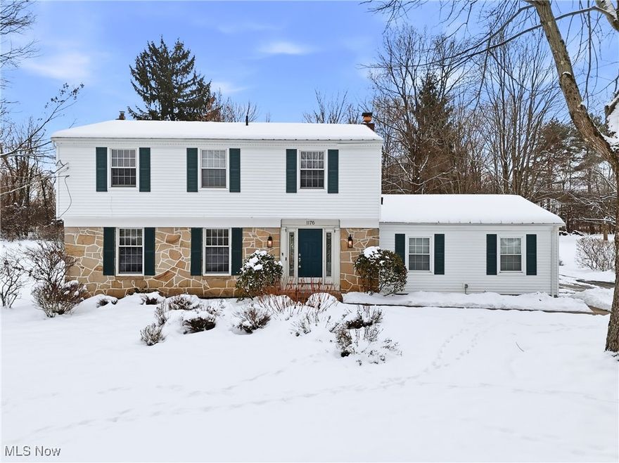 Welcome to this charming, move-in-ready home in the beloved Chagrin Lakes community, where residents enjoy lake access, private beaches, fishing, walking trails, playground, and more! This beautifully maintained five-bedroom, 2.5-bath home sits gracefully on its lot with an inviting stone-sided exterior and a spacious, flat backyard perfect for gatherings, play, and warm-weather enjoyment. Step inside to a freshly painted foyer with updated fixtures and convenient access to both the garage and half bath. The light-filled sitting room features a cozy fireplace, a full wall of windows and a door that opens directly onto the back patio, creating ideal indoor-outdoor flow. The well-sized kitchen offers a center island with barstool seating, stainless steel appliances, and a large picture window overlooking the backyard. The dining room, framed by generous windows, opens to the family room—an excellent space for entertaining or relaxing. Upstairs you’ll find five comfortable bedrooms and two beautifully updated full baths; the primary suite showcases a renovated en-suite with a walk-in shower, updated vanity, and modern flooring, while the spacious hall bath features a new vanity, subway-tile shower, and updated flooring. The partially finished basement adds meaningful bonus space, enhanced with gym flooring and wall-to-wall mirrors for workouts or hobbies. Outside, enjoy a flat, usable yard with a patio and a dedicated playground area complete with a swing set. Recent improvements include refinished upstairs hardwood floors (2019), new dishwasher (2019), master bath renovation (2025), hall bath renovation (2024), new outdoor lighting (2024), new garage-door opener system (2025) and more! See supplements list for full details. You won't want to miss this one! Reach out to listing agent today to schedule a private showing!