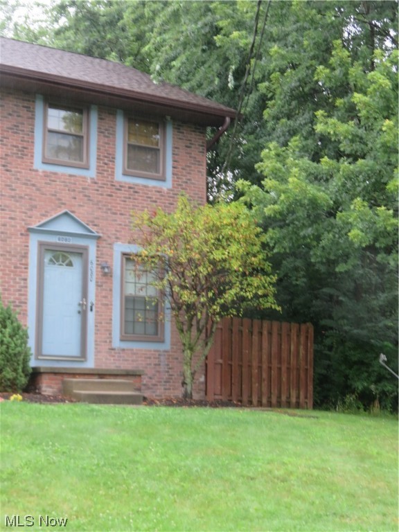 Maintenance- free living with this beautiful townhome located in Boardman Schools. While entering the appointed living room, the laminate flows through the entire first floor. The eat in kitchen features stainless steel appliances. newer modern white cabinets. The cabinets offer motion activated cabinet lighting, tiled backsplash and base cabinets with convenient pull out shelving. There is a half bath on the first floor perfect for guests to use. Upstairs, two spacious bedrooms with ample storage space and an updated full bath with white subway tile and laminate. Located in the full basement is the laundry area, sump pump, as well as plenty of room for storage and even a possible rec room! The rear deck has been painted and provides access to the carport and storage area, a second assigned parking space as well. There is also a partially fenced side yard maintained by the HOA. Replacement Pella windows in 2017, roof 2016. A one year home warranty is also included for added peace of mi