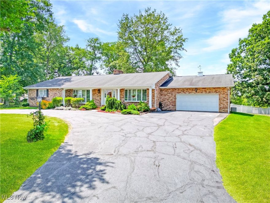 Welcome to this impressive 2,900 sq ft brick ranch featuring 3 bedrooms and 2.5 baths, perfectly situated on a generous lot in a desirable neighborhood close to local amenities. The inviting foyer leads to an elegant sunken family room highlighted by beamed ceilings, a cozy fireplace, and gleaming hardwood floors. To the right, a bright living room filled with natural light connects seamlessly to the formal dining room, both showcasing beautiful hardwood flooring.

The large, updated kitchen offers custom cabinetry, quartz countertops, and new stainless steel appliances, along with convenient access to the backyard. The primary bedroom provides excellent space with a walk-in closet and a large en-suite bathroom. A guest bedroom also includes a private en-suite, offering added comfort and versatility. A spacious main-level laundry room adds to the home’s convenience.

Step outside to a private, vinyl-fenced backyard featuring a generous deck with an awning—ideal for outdoor gatherings or quiet relaxation. This home offers remarkable room to live, entertain, and enjoy in an outstanding location.