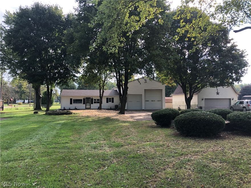 Completely remodeled ranch home situated on a double parcel of land.  Nice open concept tin brand new kitchen.  Updates also include a remodeled bathroom, all new flooring, fresh paint, furnace and air conditioning, new shingles, updated electric and plumbing.  This home also features a Large 24x30 attached garage with a Bay door that is RV height.  There is a walk up storage area in the garage which could be used for a workshop or many other uses.  Two sheds for additional storage.  Nice quiet area on a large nice lot with mature trees and shrubs.  This home is completely updated and is move in ready.