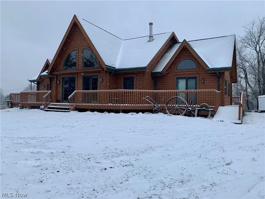 Nestled in the woods, is this beautiful log home with the perfect wrap-around porch, overlooking the remarkable 28 acres. On the property is a detached 2 stall garage, a very well maintained and large pole barn, 2 rental cabins, as well as a pond! Inside, you will notice huge main living space, open to the dining room, large enough to accommodate family gatherings of any size, as well as a large kitchen! The main floor also has a laundry room, with an exit door to the porch, perfect for those muddy boots, a grand master bedroom, with french doors leading to the wrap-around porch, a walk-in closet, as well as a large bathroom, with a soaking tub and stand-up shower. From the front entrance, you will notice the extra wide staircase leading to the loft, which includes 2 guest bedrooms, with large closets, and a guest bathroom! Do not delay, schedule your showing today!