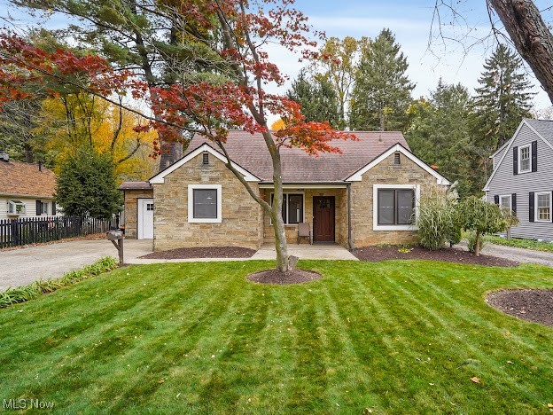 Convenient prime West Akron location. Adorable garden cottage style home exudes with charm. The open floor plan offers ease when entertaining or simply relaxing at home. Many original features throughout the home such as hand-hewn accent beams, 2 exquisite exterior doors and 2 working fireplaces. Newer renovations along with modern farmhouse design blends the character of old and new. The kitchen opens to the living area, boasts white cabinetry, white apron/farmhouse style sink, gorgeous medium express stained butcher block countertops, stainless steel appliances and newer light fixtures. The brick wood burning fireplace w/wood hewn mantel, pantry with barn style sliding door and bar height wooden table adds to the character of the vintage style of years gone by. Cedar plank ceilings span both in the kitchen and dining room. There is a whitewashed stone fireplace in the living room. Located off the living room is a sunroom that overlooks the private backyard surrounded by a vinyl privacy fence. Both bathrooms have been completely updated--one bathroom between both bedrooms, has a tiled shower/tub combo, ceramic tile flooring, updated vanity and updated light fixture. The other full bathroom on the main level boasts a large walk-in shower that has a waterfall shower panel with body spray. Laminate wood flooring in the kitchen, living room, hallway and 2 bedrooms on the first floor were recently installed. Bedrooms 3 & 4 are on the 2nd level. Replacement windows. The interior of the home has been recently painted. The hot water heater was replaced in 2023. Included with the sale at no value is a SS 3 door refrigerator, SS gas convection oven, SS 3 compartment sink, SS handsfree sink, SS 8 ft prep table and LVT flooring. The home is conveniently located near shopping and restaurants. Easy access to major highways and downtown Akron. Don't miss out! Come see this gem today!