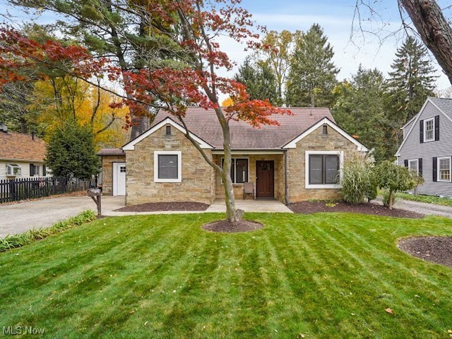 Convenient prime West Akron location. Adorable garden cottage style home exudes with charm. The open floor plan offers ease when entertaining or simply relaxing at home. Many original features throughout the home such as hand-hewn accent beams, 2 exquisite exterior doors and 2 working fireplaces. Newer renovations along with modern farmhouse design blends the character of old and new. The kitchen opens to the living area, boasts white cabinetry, white apron/farmhouse style sink, gorgeous medium express stained butcher block countertops, stainless steel appliances and newer light fixtures.  The brick wood burning fireplace w/wood hewn mantel, pantry with barn style sliding door and bar height wooden table adds to the character of the vintage style of years gone by. Cedar plank ceilings span both in the kitchen and dining room. There is a whitewashed stone fireplace in the living room. Located off the living room is a sunroom that overlooks the private backyard surrounded by a vinyl privacy fence. Both bathrooms have been completely updated--one bathroom between both bedrooms, has a tiled shower/tub combo, ceramic tile flooring, updated vanity and updated light fixture. The other full bathroom on the main level boasts a large walk-in shower that has a waterfall shower panel with body spray. Laminate wood flooring in the kitchen, living room, hallway and 2 bedrooms on the first floor were recently installed.  Bedrooms 3 & 4 are on the 2nd level. Replacement windows. The interior of the home has been recently painted. The hot water heater was replaced in 2023. Included with the sale at no value is a SS 3 door refrigerator, SS gas convection oven, SS 3 compartment sink, SS handsfree sink, SS 8 ft prep table and LVT flooring. The home is conveniently located near shopping and restaurants. Easy access to major highways and downtown Akron. Don't miss out! Come see this gem today!