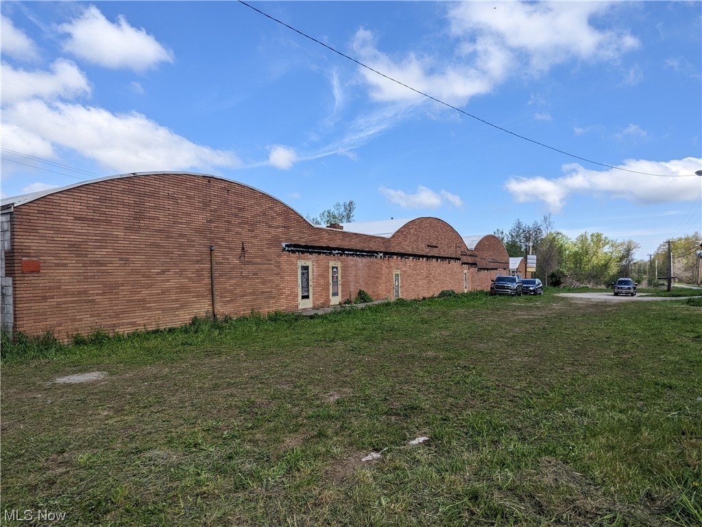 Income producing multi-tenant property for sale in Perry, Ohio. Three buildings making up 31,420 SF. Zoning I-1 (Light Industrial). The front building on Lane Road was originally built as an 5-unit multi-tenant building with the main entrances in the front and overhead doors/loading docks in the rear. Two 6,000 SF buildings are to the west of the main structure and can be used for multiple industrial purposes. Utilities include 3-Phase 480v power (Illuminating Company) and natural gas service (Dominion East Ohio). Water is available via water well that needs to be serviced. Public water is immediately available along Lane Road. Septic was previously used however, the system has been abandoned. Vacant wooded area to the west is accessed through CEI right of way and may be considered for future development. Current month-to-month tenants and potential for additional leasing income!