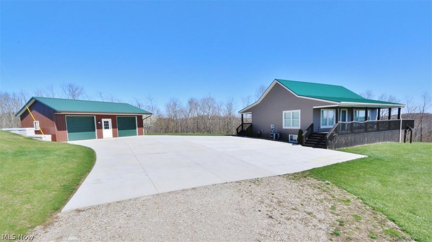 Remarkable home situated on nearly 56 acres offers fantastic views of the countryside! Beautiful home, many special features! Custom cabinets highlight the equipped kitchen. Engineered wood flooring. Blackout blinds. Full, finished, walk-out lower level opens to a large covered patio for relaxing and taking in the wonderful views! Home is already wired for generator. Newer 2-car garage / pole barn with concrete floor. This is a rare find you'll want to see! Two quads can go with the sale!