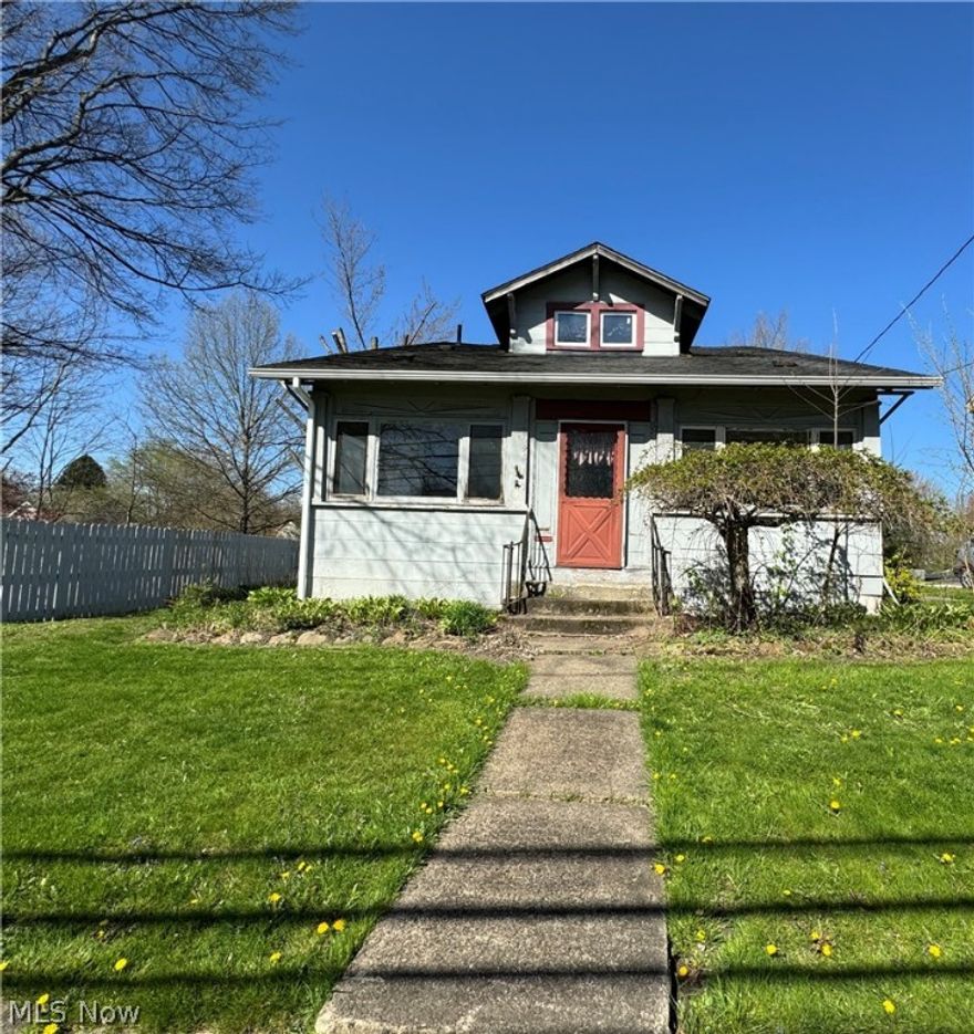 If you are looking for your next rehab home or you’re handy, snag up this bargain! Located in downtown historic Garrettsville, close to parks, schools and shopping. Home is in need of repair, updating and being sold “as is”  FHA/VA financing is not available for this house. First floor master bedroom and remodeled bathroom. Some beautiful woodwork and built in cabinets. Upstairs has possible 3 bedrooms. Enclosed front porch to watch parades go by! This is an amazing offer for someone that is handy or wants to work on their home and build your equity instead of renting-Driveway is located off White St.