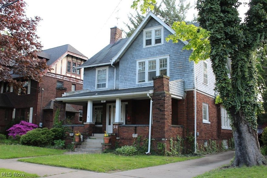 Opportunity to make this house your own on one of the most charming streets in West Akron.  Large living room with fireplace and formal dinning room. Four bedroom and two full and one half bath.  Some wonderful original fixtures left untouched! Two car garage.  Hardwood floors throughout.     Located near desirable highland square area shops and restaurants.   At this price, this one is not to be missed!
