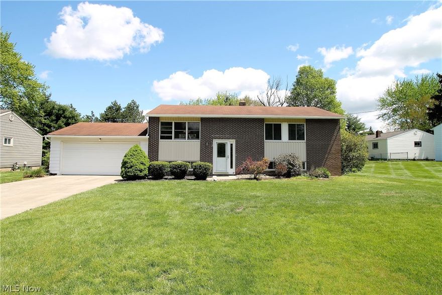 Welcome to this charming, three bedroom, two full bath bi-level home. Come on in to the living room, dining room, kitchen that offers hardwood floors throughout the main level. The living room has an open floor plan with windows to let the natural light shine through and is open to the dining room which has a new slider door with built in blinds (2016) that leads to the two-story deck where you can sit out to enjoy the view overlooking the beautiful, large fenced in backyard. The bright, large kitchen offers abundant of cabinets, counterspace, built in desk, dishwasher (2017), built in microwave, refrigerator. There are three bedrooms, and a bright, recently, remodeled full bathroom with granite countertops that is all on the main level.  The lower level offers a family room with new carpet (2017), plenty of room for entertaining or just relaxing, rec area, plenty of storage area, laundry, and a full bathroom. There is a attached two car garage. Some upgrades include gutters front repl