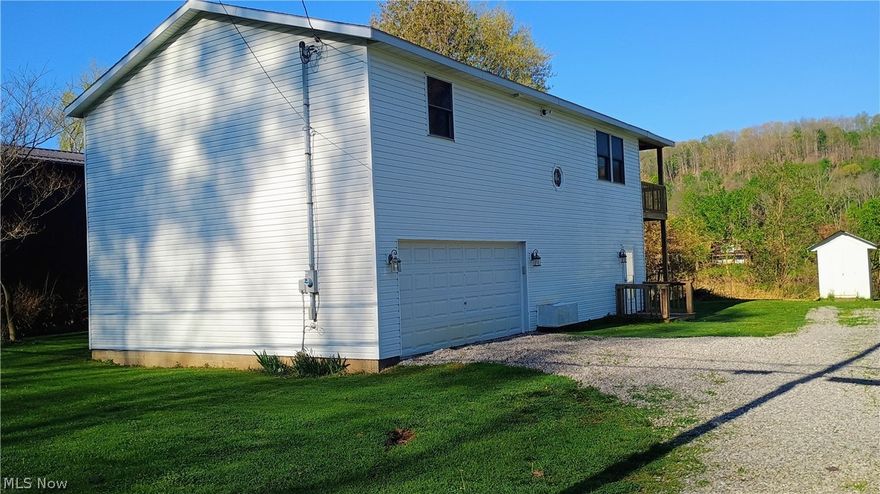 Riverfront living year round. Nice view of the Muskingum river from two decks that are the full width of the house. The basement is ground level and features a full bath and family room. On the second floor you will find a large living room with French doors to the covered wood deck. The living room flows into the dining area and kitchen. The kitchen has all new appliances, counter tops, flooring and lighting. The new flooring and lighting are carried through the whole house. There is another set of French doors in the dining area leading out to the large deck. The home has new paint, flooring, some new plumbing, and new commodes. The over size two car garage has an electric door opener. This residence is ready to move in and enjoy the view.