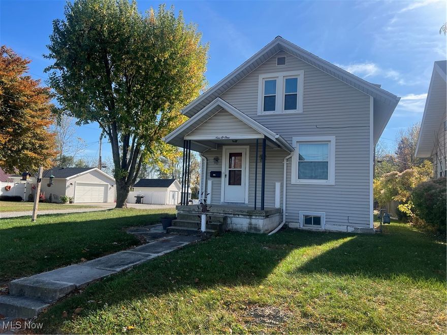 WHY PAY RENT WHEN YOU CAN OWN THIS READY TO MOVE INTO HOME?  2 bedrooms, 1 full bath.  Living room, dining room and a kitchen with eating bar and range & refrigerator. Many newer replacement windows.  House roof approx. 2008+-. Water heater 2018+-. Gas forced air furnace 2010+-. Central air. Washer/dryer in basement stay. Vinyl sided with leaf filter gutters. Super 24' x 24' garage with new garage door and opener approx 2022.  Garage roof 2023+-. The storage shed off the porch stays.  Being sold "AS IS". Don't wait, call now to see how you can own this affordable home.