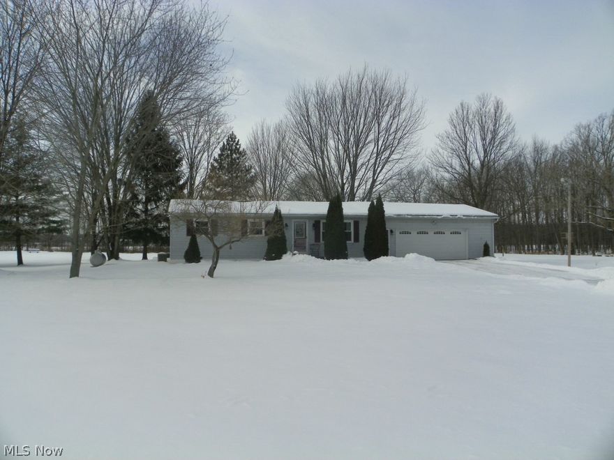 Updated Ranch on a over 1.5 Acres of open spaces and mature trees.  A cozy living room with a wall of built-in shelves, storage, and fireplace welcomes you when you step through the front door.  Warm, Neutral paint colors throughout the house.  No Wallpaper!  A total kitchen remodel in 2012 offers loads of counter and cabinet space.  All kitchen appliances are included.   There's over 400 additional sqft of living space in the basement that was finished in 2010.   New Water Heater in 2010.  New Air Conditioner July 2013.  A New Door was added to the over sized two car Garage in 2010.  Sale also includes Washer & Dryer.  A deck was added in 2010 to the existing patio area overlooking the spacious back yard.  Home Warranty Included.