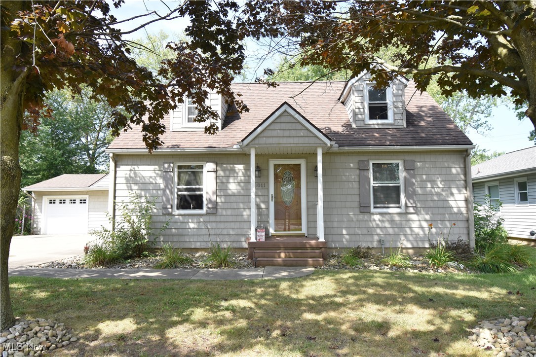 Beautiful Cape Cod home in Buckeye Schools with 4 bedrooms, one and a half baths, and loads of privacy on a fenced double lot! A stylish and welcoming exterior ushers you inside, where you'll find newer vinyl plank floors, newer carpeting, a very functional layout, and tons of storage and adorable built-ins throughout. Pride of ownership shines through here! The current owners have put this home through multiple renovation projects over the years. The full bathroom was remodeled approx 2 years ago with waterproof vinyl flooring, vanity with great counter space and storage, tub/shower surround, and all fixtures. Windows updated about 2 years ago for most of the house, and circa '07 for the eat in kitchen. The '06-'07 renovation also included vinyl siding, roof, concrete driveway & garage floor, exterior doors & screens, and the back patio. The sewer line from the house to the street has been updated to pvc with a check valve in front yard & The storm sewer line has a check valve too, past the crock that the basement french drains feed into; ask agent for details on this well-planned preventative maintenance feature. The exterior of this home overflows with charm, from the nicely landscaped front yard with mature trees and a privacy fence on the southern border, to the fully fenced back yard, perfect for pets. Relax and enjoy the view from the back patios, with both a covered and uncovered patio option for entertaining, and the grill stays! Between the storage shed, a 2 car garage with workbench, and the lower level, you'll have a spot for everything! Come take a look at this wonderful home and start planning your move!