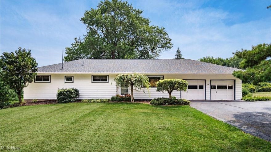 Significant price improvement! Lovingly cared for and meticulously maintained, what a charming mid-century home! Sitting on almost 3 acres of lush rolling hills on a quiet dead-end street, this is a slice of rural paradise, just outside of the city! Original beautiful hardwood floors, tiled bathrooms, new windows, new roof/gutters/downspouts, ample kitchen cabinets and built-in storage. Three bedrooms, and a rare Owner's ensuite bathroom! Enjoy peaceful summer evenings on the open back deck or from the comfort of the roomy screened porch. Full basement with direct walk-out has so much potential for added living space. Welcome home!