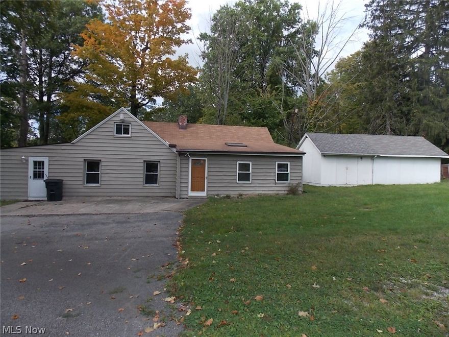 Park like setting. 1.37 acres to enjoy.  House has 2 bedrooms one up and one down - full bath - laundry area- spacious eat in kitchen with all appliances and living area.  Room in out buildings for storage.  Show and write offer