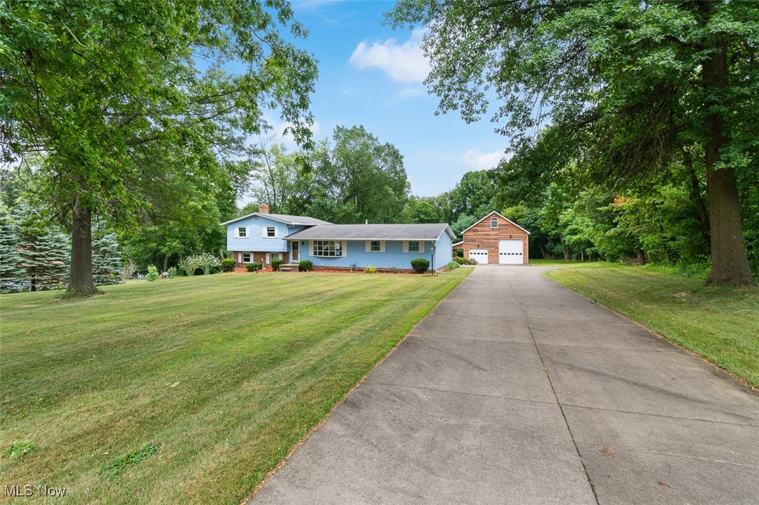 Home And Shop On 3 Acres, Park-like Setting. Tuscarawas Twp., Massillon CSD, Stark County. Live Auction with Online Bidding Available. ABSOLUTE AUCTION, all sells to the highest bidder on location. ONLINE BIDDING BEGINS TUESDAY, AUGUST 19, 2025, at 12:00 PM, and AUCTION LIVE ON-SITE BIDDING WILL BEGIN FRIDAY, AUGUST 22, 2025, at 11:30 AM, REAL ESTATE SELLS AT 12:00 PM. Real Estate features three acres with a charming split-level home and a large shop. Great setting, stately trees, secluded backyard! The main level features a bright living room with large bay windows, a kitchen with a dining area, and access to an attached garage. Upstairs includes three bedrooms and a full bath with a tub shower. In the lower level, you will find a spacious family room with wood wood-burning stove, a full bathroom, an office, an enclosed porch with backyard access, and a laundry/utility room. Gas furnace, central a/c, 200-amp breaker electric, city water, septic. Clean home ready for updates. The shop features a 32'x40' main room with 16-foot sidewalls, three overhead doors, and a spiral staircase leading to a loft. A 24'x24' insulated workshop with 10-foot ceilings and an overhead door, and a covered porch that offers a peaceful view of the backyard. Built in 2005, block foundation, ideal storage for RV, cars, boats, or equipment. Half-year taxes are $1,955. Stark Co. parcel #7401412. Exciting opportunity, the property has a lot to offer, very well maintained with a long-time owner! Don’t miss out, call the auctioneer for details on how to use your current home to buy this one! The property will be open for viewing on Monday, August 18, 2025, from 4:30-6:00 PM.