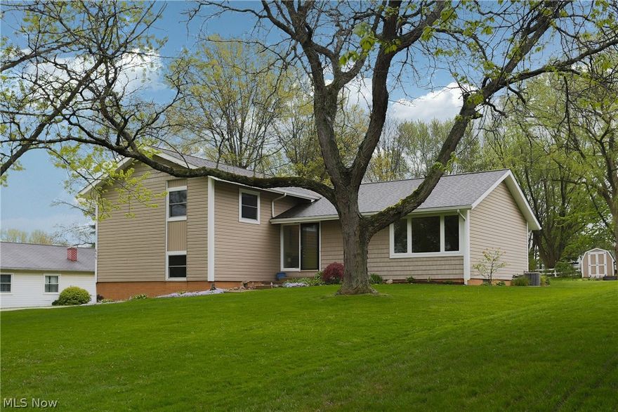 Welcome home to this move-in ready home in Four Seasons w/ optional lake amenities and GORGEOUS views of a horse barn from your kitchen! This 4 bedroom, 2.5 bath has had most everything updated! Walk into a spacious foyer w/ a large, living room directly to the right. The completely remodeled, eat-in kitchen has white cabinets w/ soft close features, gorgeous wood countertops, updated black, stainless appliances, and ceramic tile. Also, an extra large pantry was added w/ the remodel. Enjoy a separate dining room, that leads out to a patio. The 2nd level has a spacious, master suite w/ walk in shower, new vanity, toilet and ceramic tile. There are 3 other bedrooms on this level as well as a bonus room that could be a walk-in closet or office space. The 2nd full bath has a new tub surround, vanity, toilet and ceramic tile. The family room is in the lower, walk out level and has plenty of entertaining space w/ a wood-burning fireplace including travertine tile and wood mantle. This level