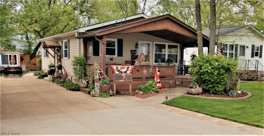 THIS IS A WOW FACTOR.  TOTAL LOVE HAS BEEN PUT INTO THIS TREASURE, PRIDE OF OWNERSHIP FOR OVER 40 YEARS.  OLD WORLD CHARM WITH UPDATED TO ENHANCE THE CHARACTER THROUGHOUT.  ADDITIONAL BUILDING IS A SUPER COOL LOG STYLE CABIN.. GET AWAY RETREAT IN YOUR OWN BACKYARD!  BUILT WITH TOP NOTCH CRAFTSMANSHIP.  I WILL START WITH THE CABIN.. IT HAS A STONE VENT LESS FIREPLACE FOR HEATING.  TONGUE AND GROVE WOOD CEILING, LOG STYLE INTERIOR AND EXTERIOR WALLS.  SET UP FOR A TV OVER THE FIREPLACE, OFF THE LIVING ROOM AREA IS A GAME ROOM AREA.  THE BACK YARD HAS A DECK/PAVER PATIO AREA WITH A FIRE PIT, BUILT IN TRAMPOLINE, SHED AND BEAUTIFULLY LANDSCAPE.  NOW FOR THE GORGEOUS HOME!  HUGE FRONT COVERED PORCH.  LARGE KITCHEN THAT HAS BEEN UPDATED WITH VINYL PLANK FLOORS, STAINLESS STEEL APPLIANCES 2017 AND SUBWAY TILE.  THE LIVING ROOM OPENS UP TO THE KITCHEN AREA AND DINING ROOM WITH BARN DOOR AND CEDAR PLANK WALLS.  ALSO VINYL PLANK WOOD STYLE FLOORING.  THE BATHROOM HAS BEEN UPDATED WITH BARN SIDIN